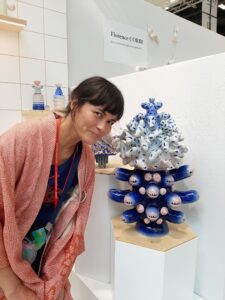 Ceramicist, Kartini Thomas beside one of her sculptures. 